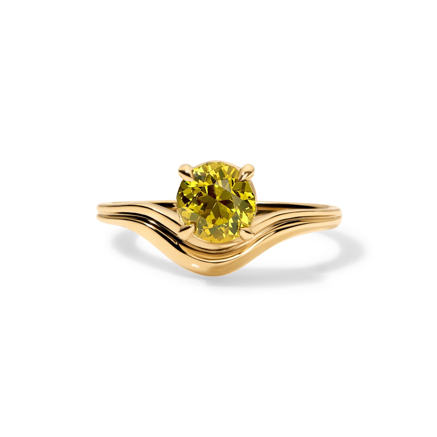 Gold ring with with a soft wave contour holding a yellow colored gemstone