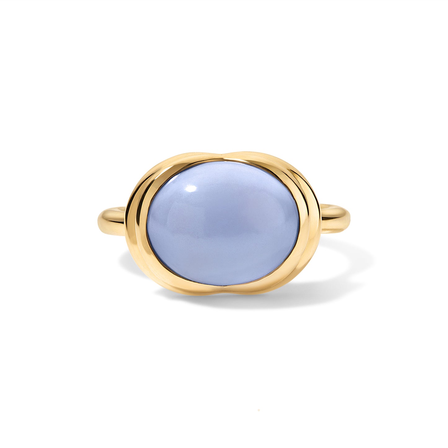 A gold ring featuring a smooth, oval-shaped light blue cabochon gemstone, presented on a clean white background with a soft shadow.