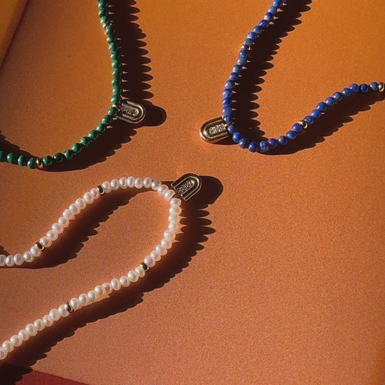 Beaded necklaces with 14k gold charms