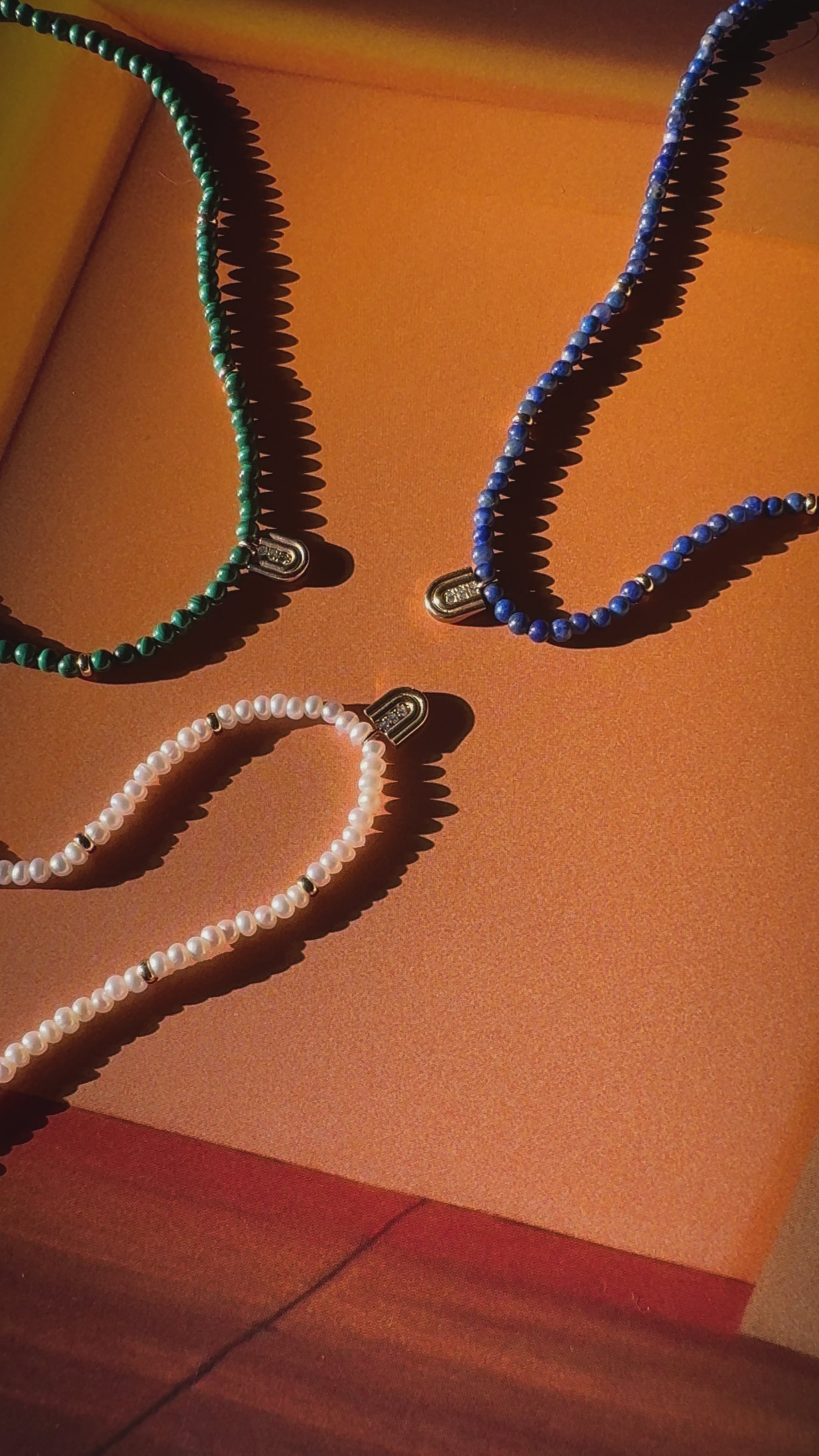 Beaded necklaces with 14k gold charms